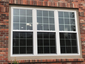 Double-hung window grouping on a brick home